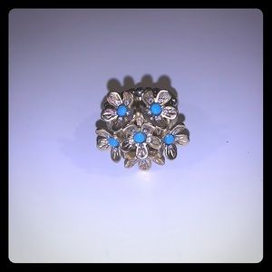 Gold flower cluster ring with blue details